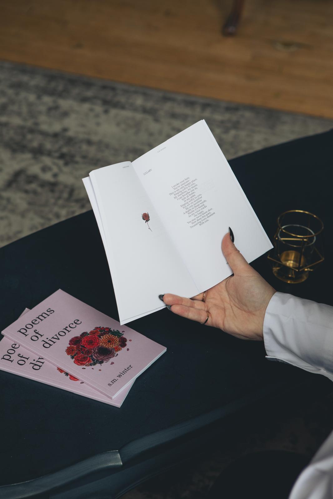 author holding book open