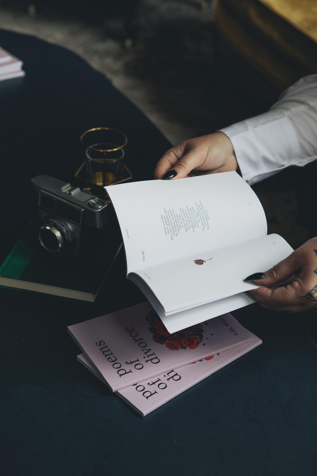 author holding book open